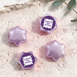 Foil-covered chocolate star candies in light purple with personalised 'Birthday' topper