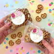 Personalised pretzel bag with pink floral round label, pretzels in clear wrap