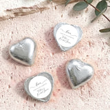 Silver heart foil chocolate with white sticker label for celebrating, personalized names.