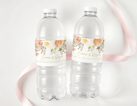 Peach floral personalised water bottle labels on clear plastic bottles, two pack