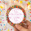 Pink christening card with giraffe pattern, multicolor bead border in clear bag
