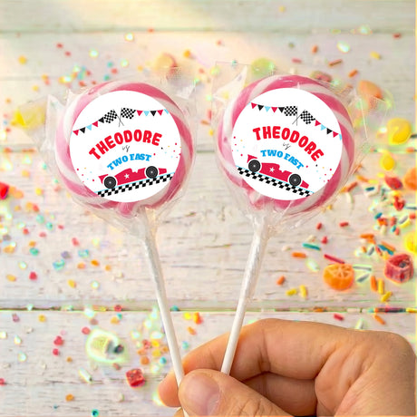 Personalised race car lollipops with pink-striped wrapper and printed car labels