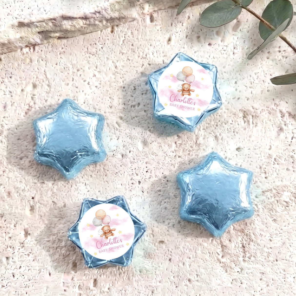 Blue star-shaped foil balloons with 'Charlotte's Baby Shower' teddy design