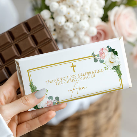 Christening chocolate bar wrapper with gold border, florals, cross, and celebratory text