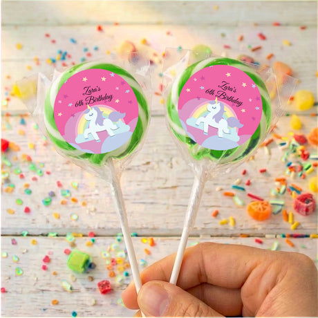 Two unicorn lollipops, 'Zara's 6th Birthday' pink labels with green outer ring