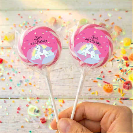 Two unicorn lollipops, 'Zara's 6th Birthday' pink labels with pink outer ring