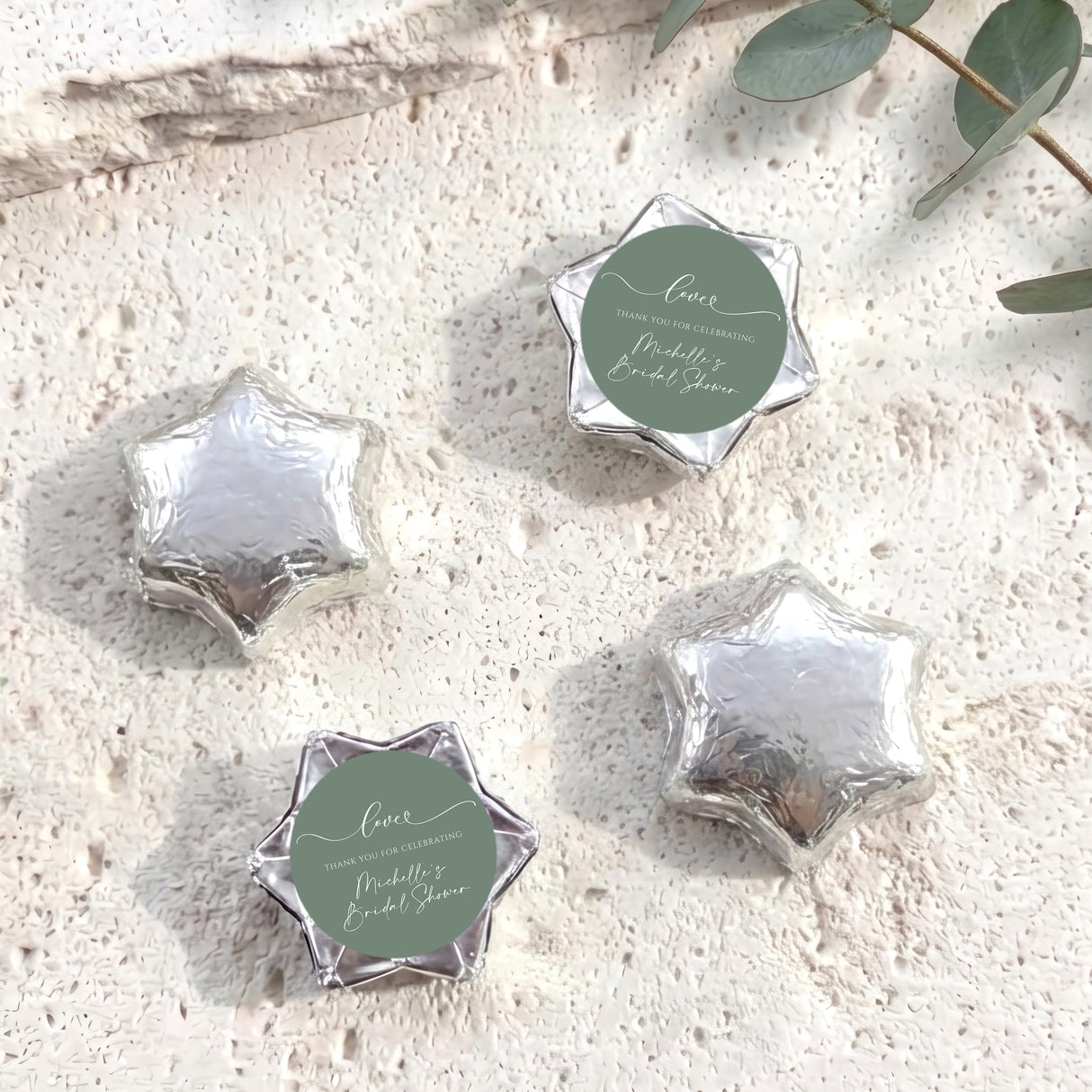 Foil-covered chocolate stars, silver with round personalized label