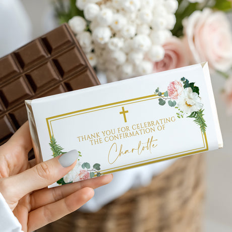 White chocolate bar wrapper with floral wreath and gold border, thank-you text.