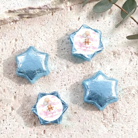 Blue foil star balloons with teddy first birthday printed center card