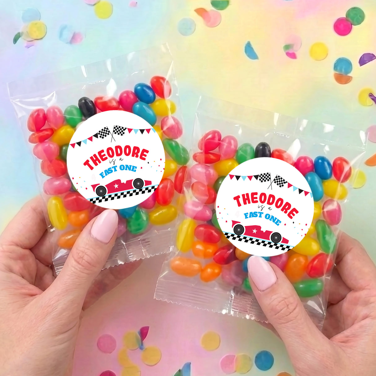 Two personalised jelly bean bags with race car labels, held hands; colorful beans