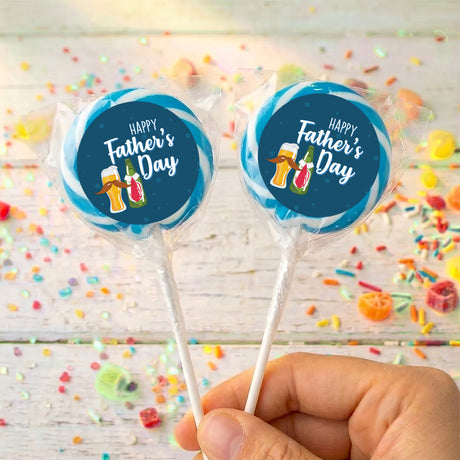 Two Father’s Day personalized lollipops with blue round labels and clear wrappers