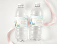 Two clear water bottles with baby shower labels, blue Peter Rabbit rabbits and flowers
