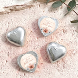 Silver foil-covered heart chocolate favors with printed thank-you label for bridal shower