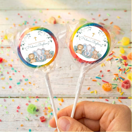 Personalised baptism lollipops with sleepy safari animals and rainbow ring label on sticks