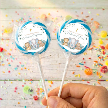 Personalised baptism lollipops with sleepy safari animals and blue ring label on sticks
