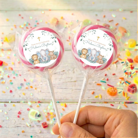 Personalised baptism lollipops with sleepy safari animals and pink ring label on sticks