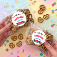 Personalized pretzel bag with pretzels and round label reading THEODORE TWO FAST