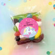 Personalised unicorn lolly bag with circular label: Lara's 6th Birthday, assorted sweets