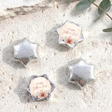Silver foil-covered chocolate stars with a “Happy Mother’s Day” label card