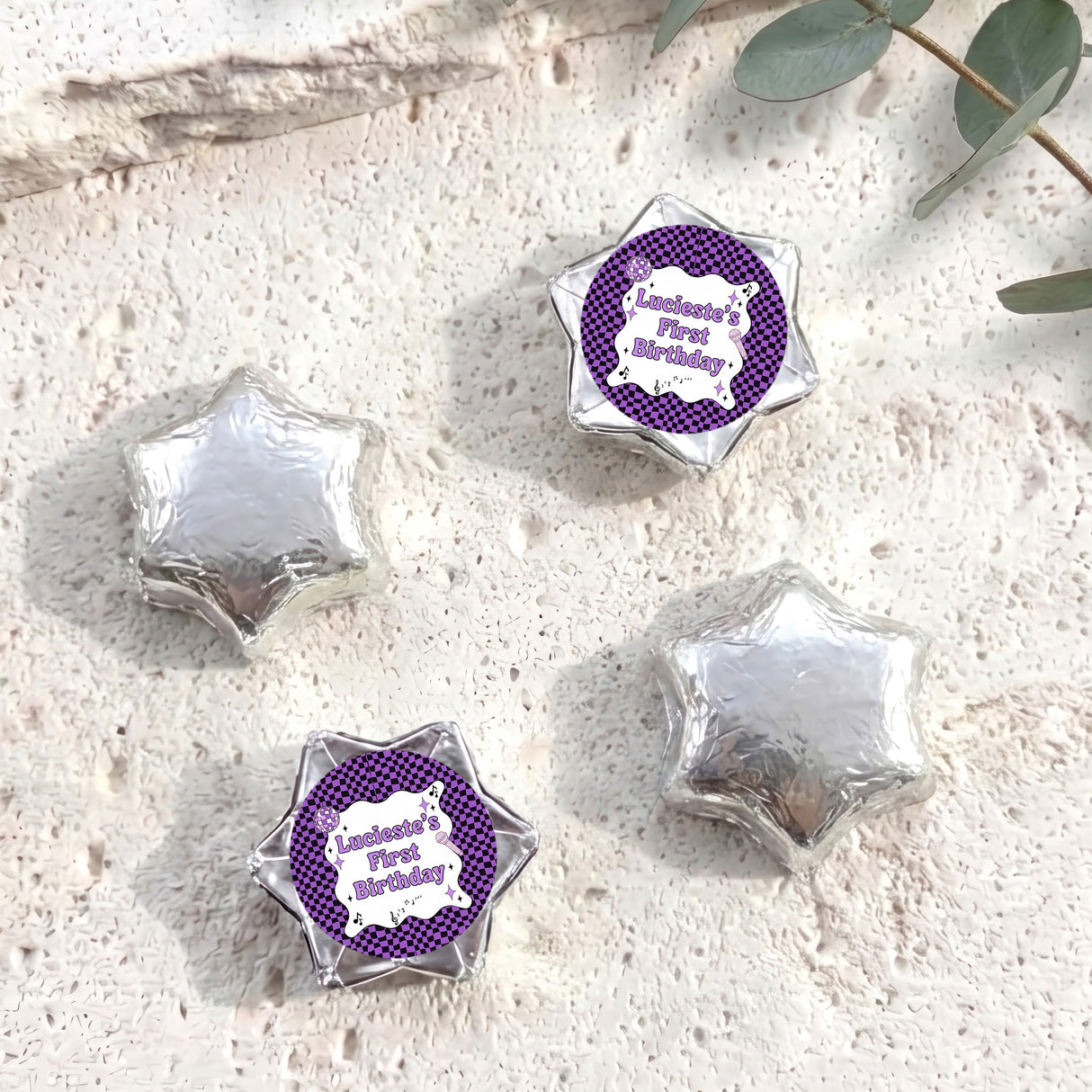 Foil-covered chocolate star candies in silver with personalised 'Birthday' topper