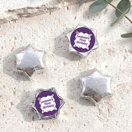 Foil-covered chocolate star candies in silver with personalised 'Birthday' topper