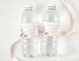 Two clear water bottles with pink Peter Rabbit baptism day personalised labels
