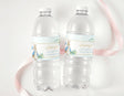Clear plastic water bottles with light blue Peter Rabbit first birthday labels