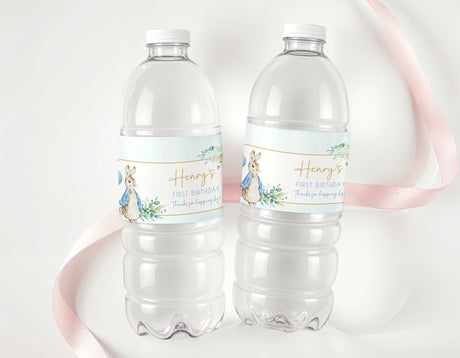 Clear plastic water bottles with light blue Peter Rabbit first birthday labels
