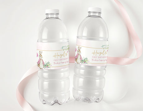 Personalised first birthday water bottle labels on clear bottles, pink floral rabbit design
