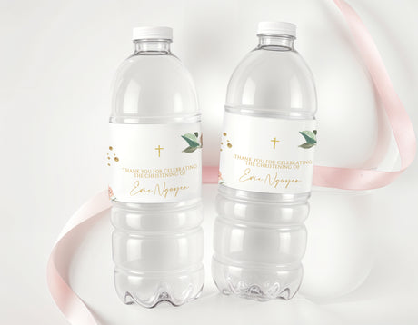 Clear plastic water bottles with white personalized labels, gold cross and flower accents
