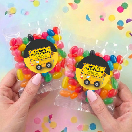 Two personalised jelly bean bags with mixed sweets and truck birthday labels