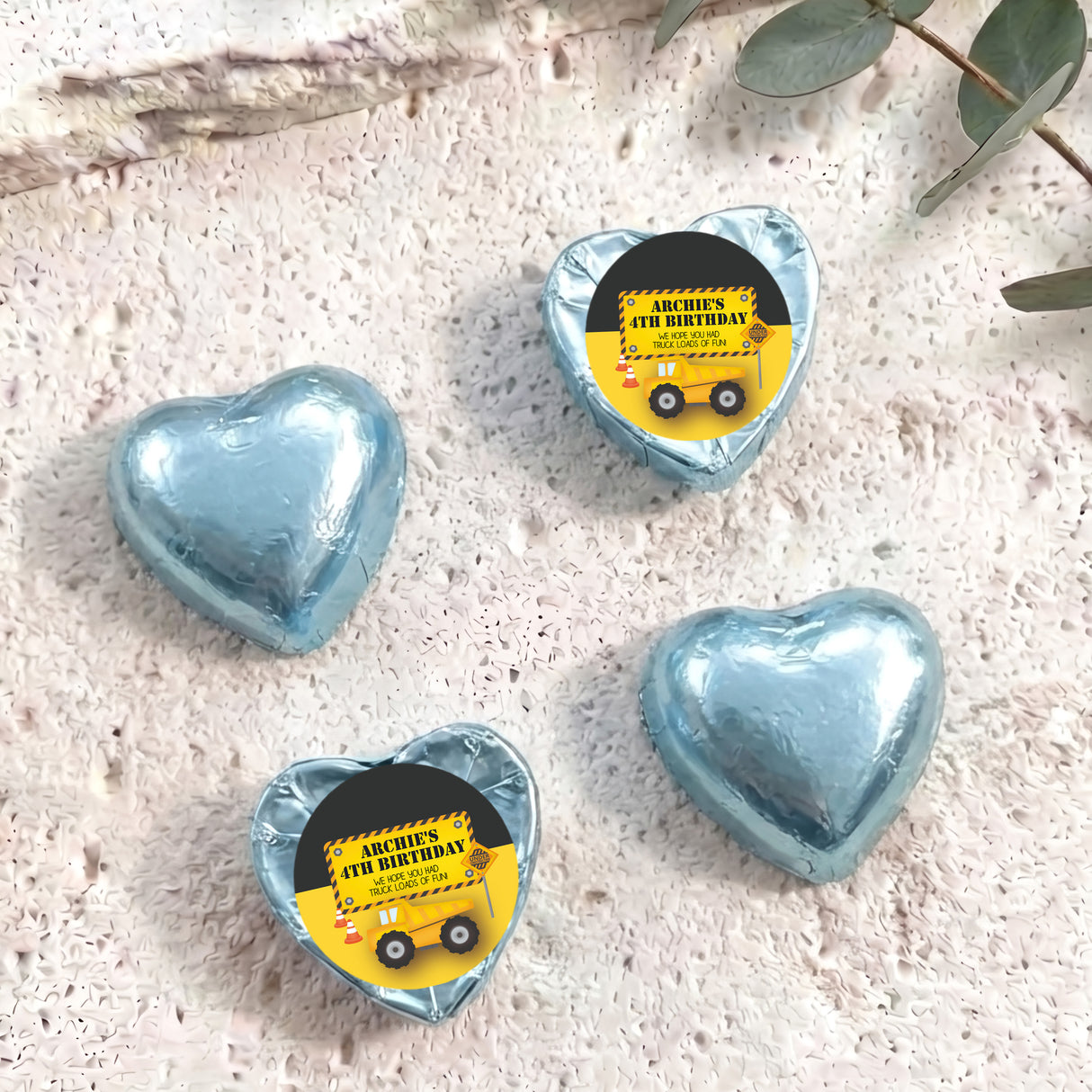Light blue foil chocolate heart with 'Archie's 4th Birthday' label