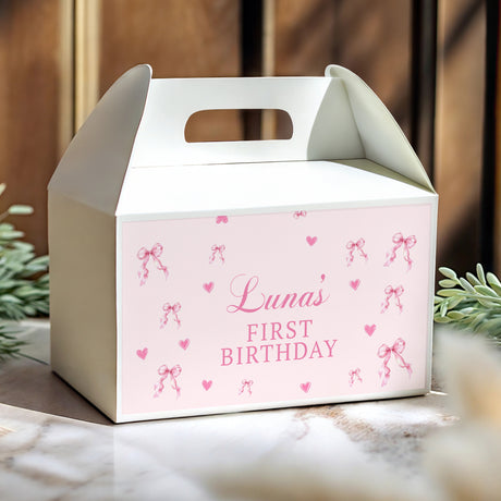 Personalised gable favour box, pink with hearts and text 'Luna's FIRST BIRTHDAY'