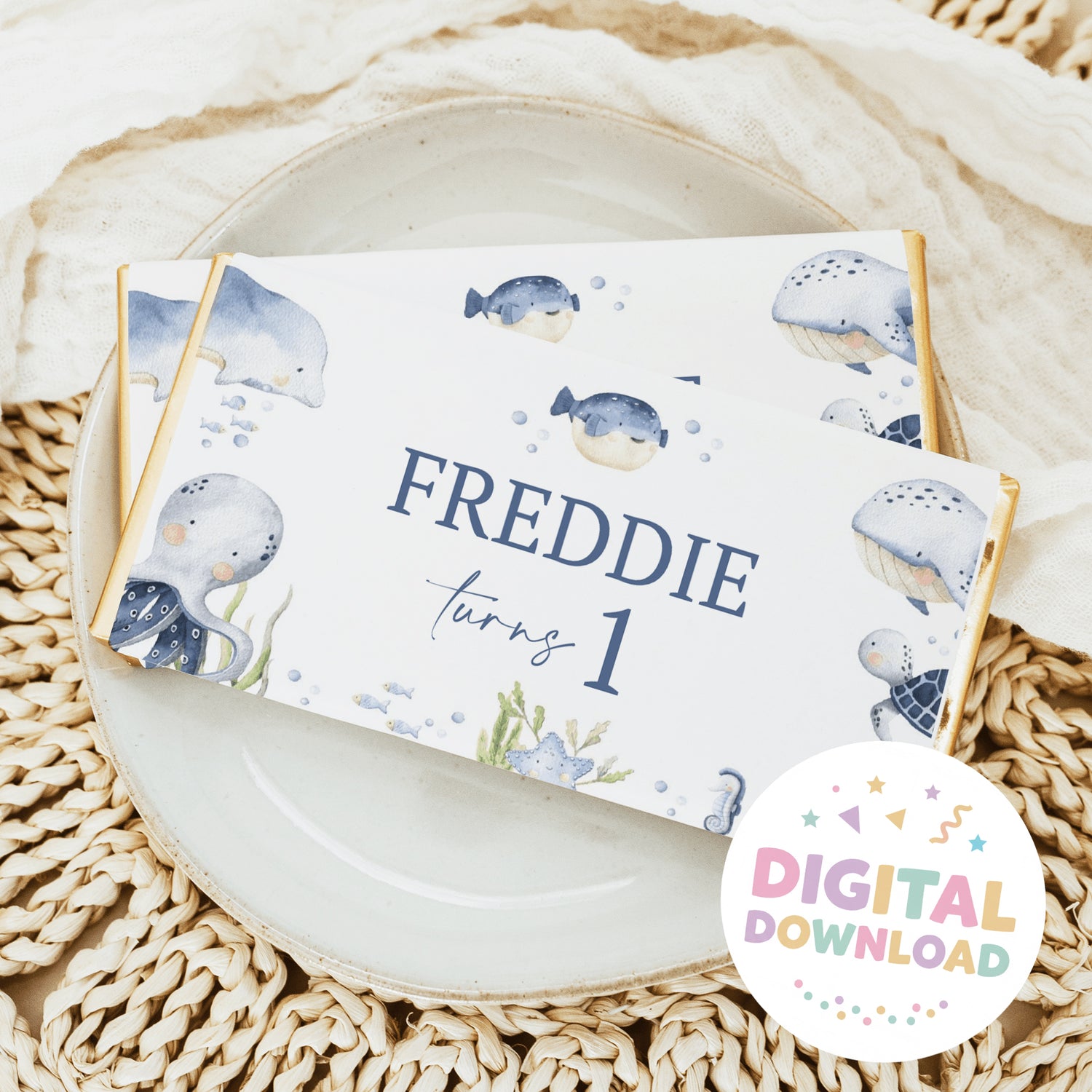 Sea-themed birthday chocolate bar wrapper with whales and 'Freddie' 'Turning 1'