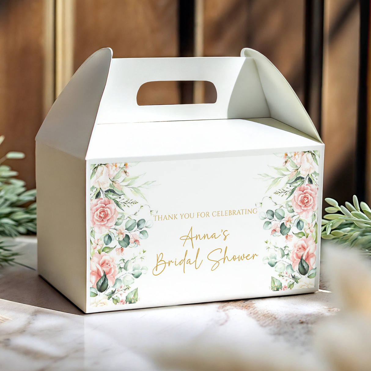 White gable favor box with pastel floral border and 'Anna's Bridal Shower' text