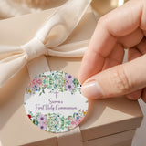 Round floral First Holy Communion label with name “Sierra’s” and purple cross text