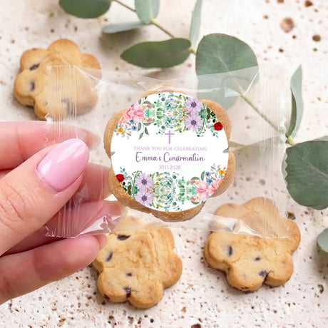 Personalised bite-size chocolate chip cookies with round celebration labels in clear bags