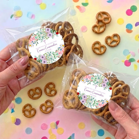 Two pretzel snack bags with clear plastic and floral round personalised labels