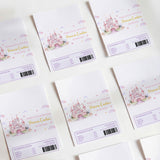 White printed chocolate wrappers with castle scene, hearts, and personal name text