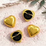 Gold foil-covered personalised chocolate heart with black 21 label and gold stars
