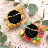 Two 40th birthday popcorn bags with clear pouches and gold star black “40” labels