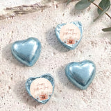 Light blue heart-shaped foil chocolate with “Happy Mother’s Day” floral message on white center