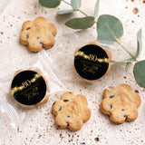 Assorted choc chip cookies in clear bags with two 80th birthday black & gold star labels