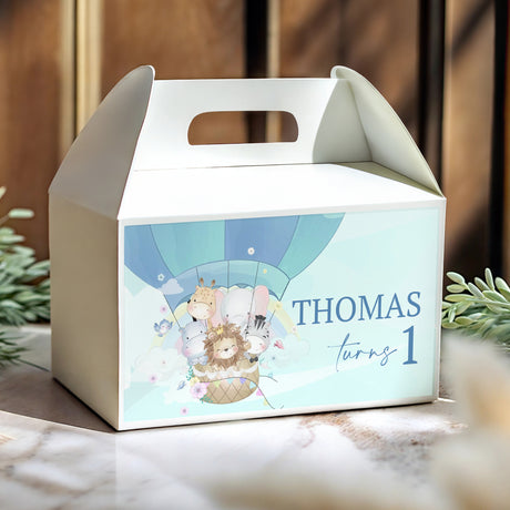 Personalised gable favour box with blue hot air balloon scene and 'Thomas' turning 1