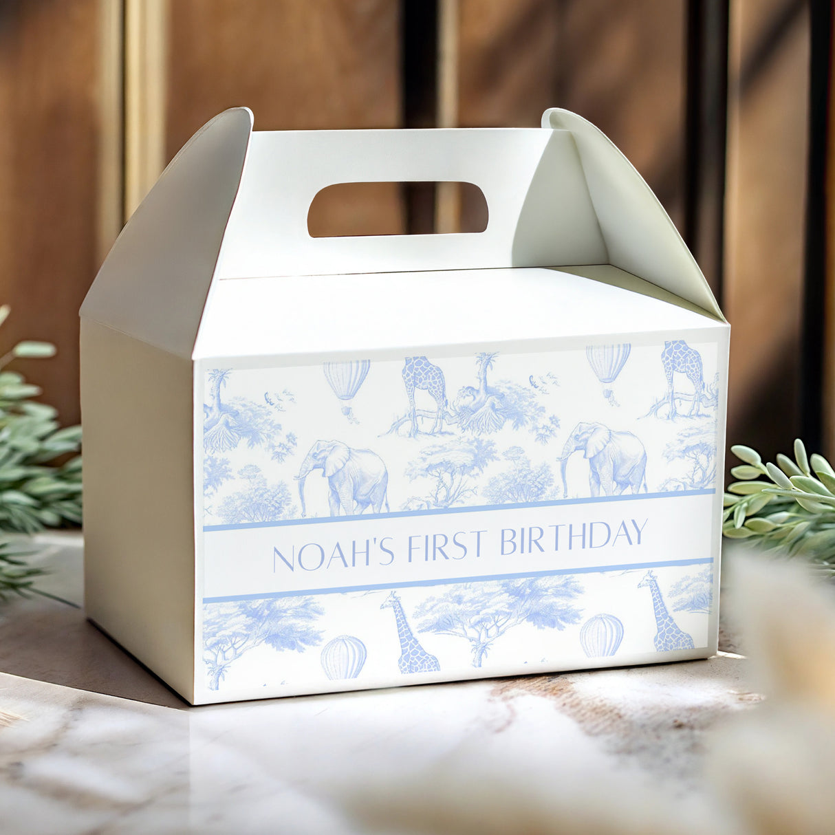Blue-and-white safari gable favour box with handle cutout and 'Noah's First Birthday'.