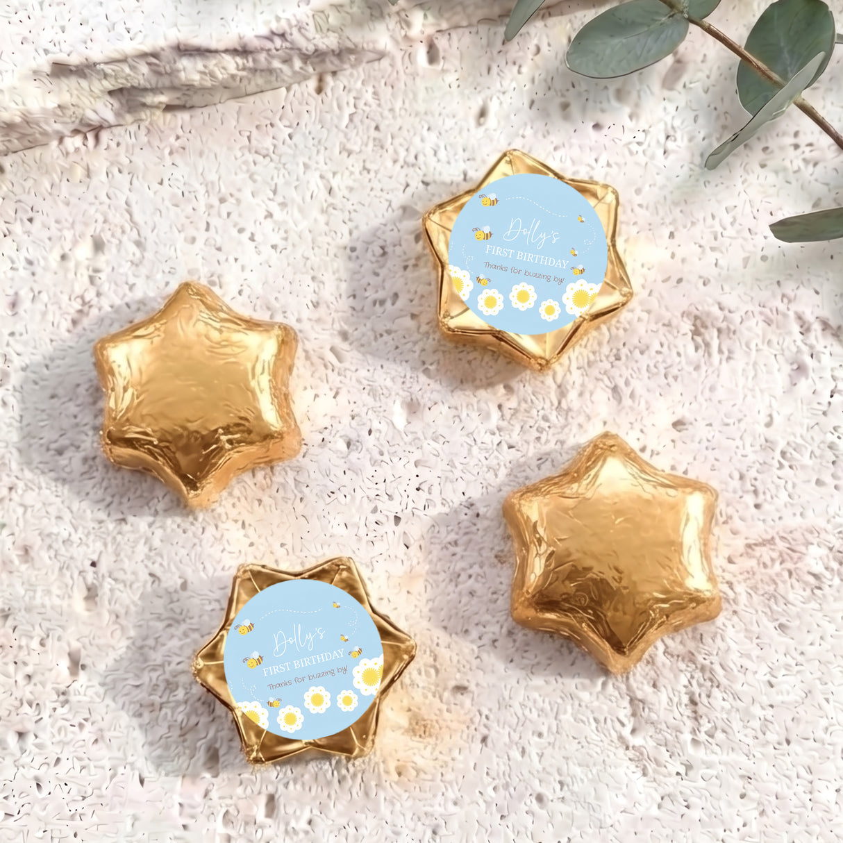 Gold foil chocolate stars with one personalised printed blue label