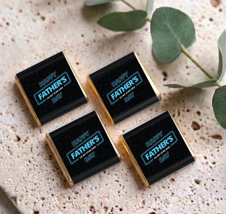 Four mini chocolates in clear sleeves with Happy Father's Day Father’s Day labels