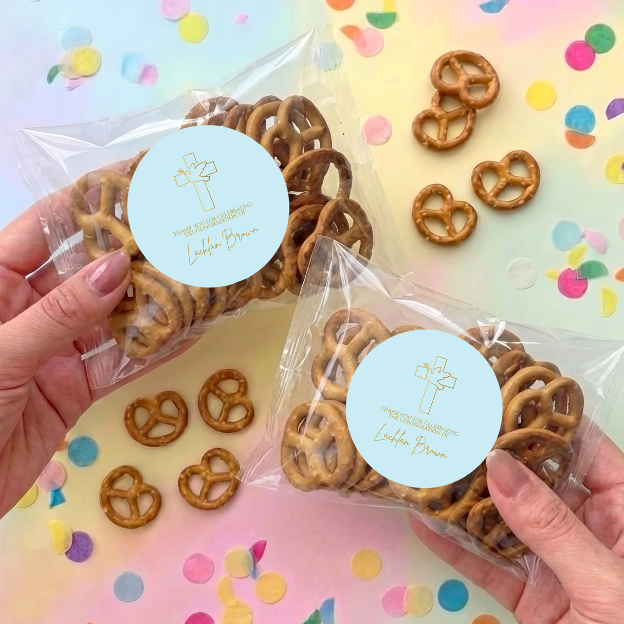 Personalised pretzel bag with cross label and brown pretzels in clear packaging