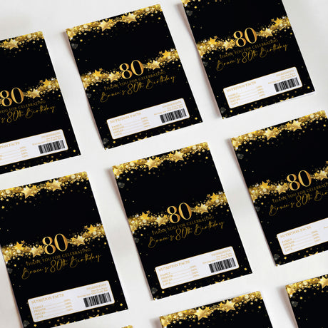Set of 80th birthday DIY printed chocolate wrappers, black with gold stars and '80'.