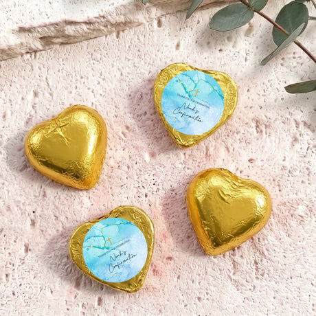 Foil-covered gold heart chocolates with printed confirmation design and name